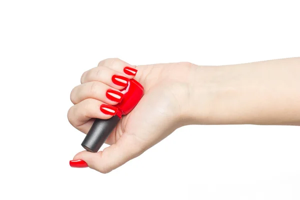 Close-up van rode nagels Pools in de hand geïsoleerd — Stockfoto