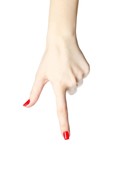 Close-up of womans hand with red nails pointing  index finger on white background. — Stock Photo, Image