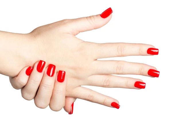 Primer plano de las manos femeninas con manicura roja — Foto de Stock