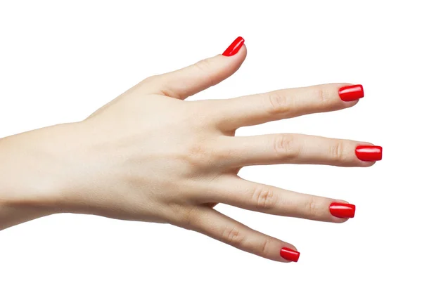 Hermosas manos femeninas con manicura roja y uña — Foto de Stock