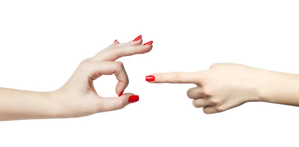 Pár rukou s upravené červené nehty sex gesto — Stock fotografie