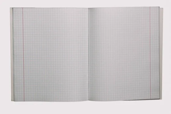 Книга упражнений в клетке, изолированной на белом — стоковое фото