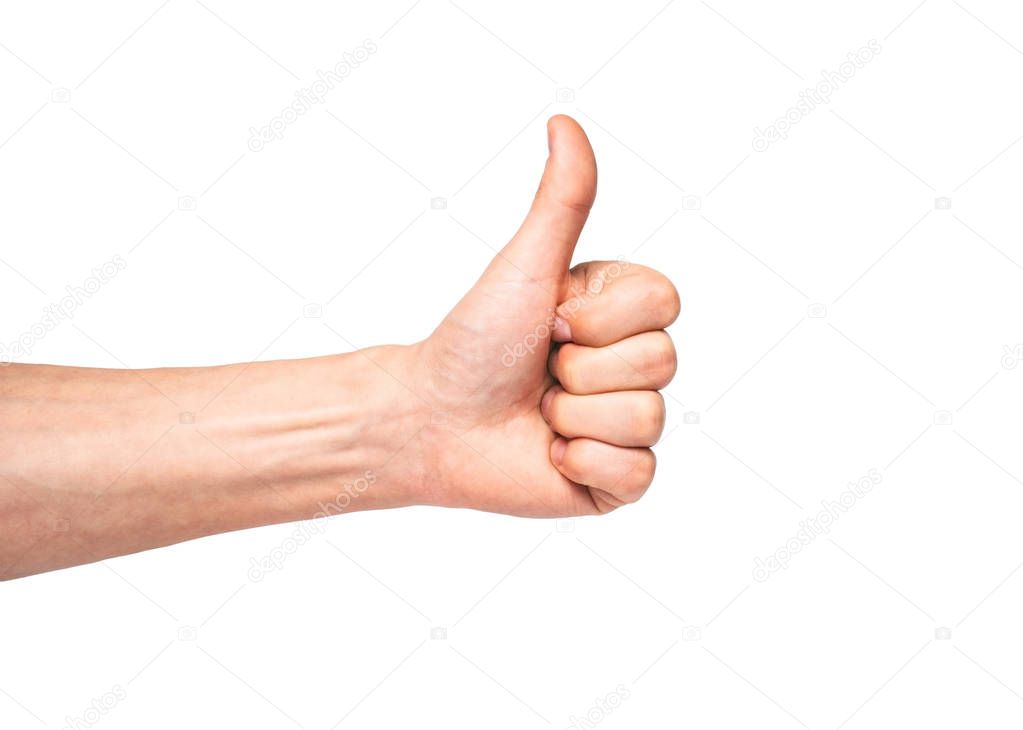 male hand showing thumbs up sign 