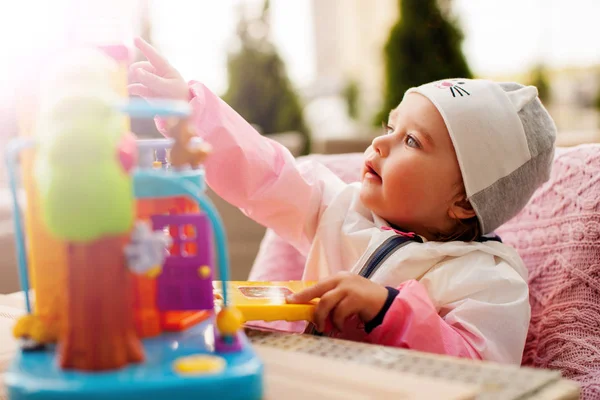 Infant girl playing with toy — Stock Photo, Image