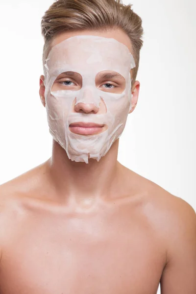Man in facial mask — Stock Photo, Image