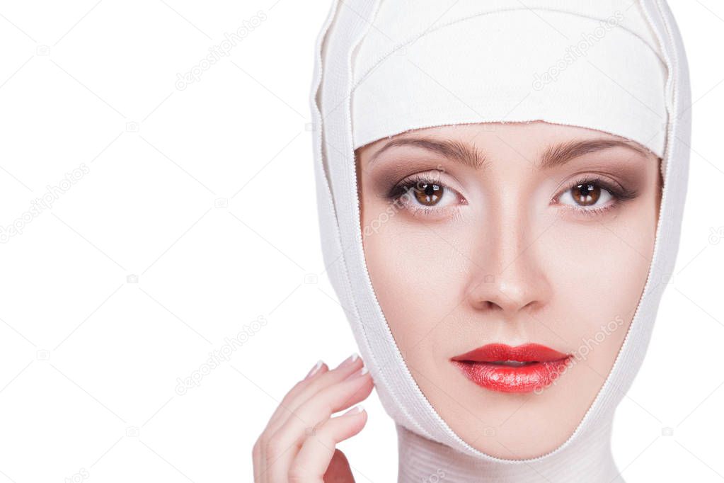 Woman in white bandages on head