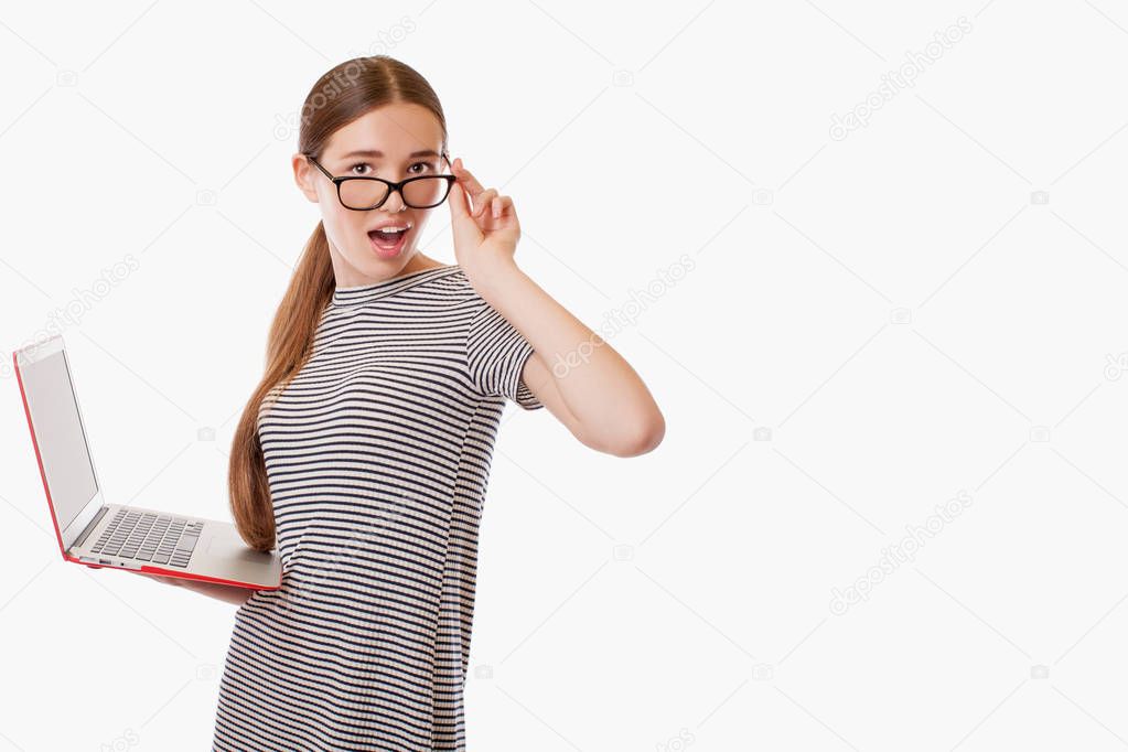 Girl looking over glasses with surprise