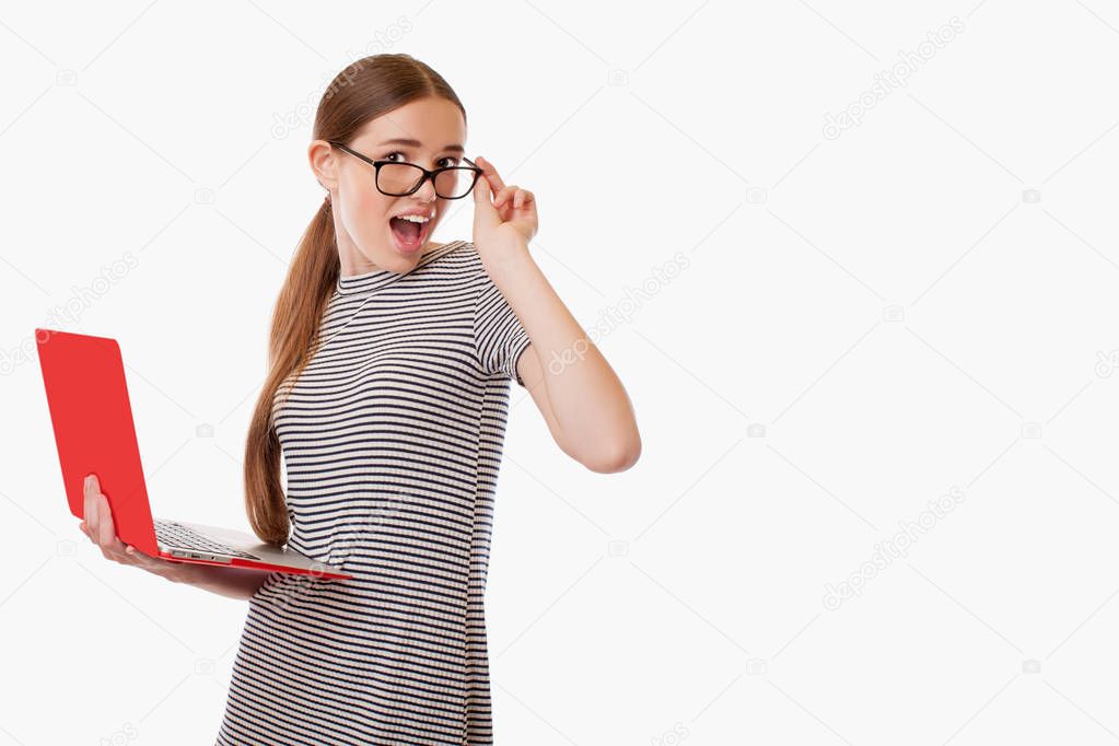 Girl looking over glasses with surprise