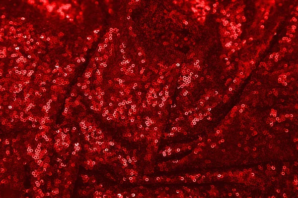 Kırmızı pullu arka plan. Tatil kartları, davetiyeler ve reklam için soyut glitter desen