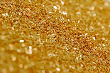 Parlak altın payet arka plan. Tatil kartları, davetiyeler ve reklam için soyut glitter desen