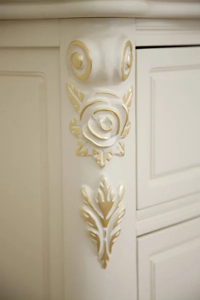 Closeup of floral decorative ornament on vintage home furniture