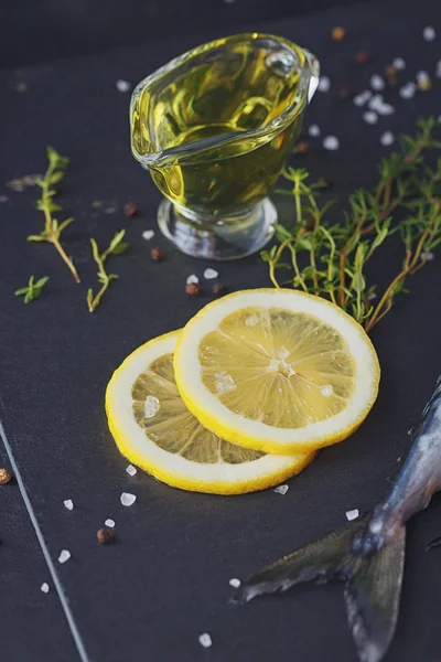 Fresh raw fish mackerel and ingredients for cooking on a dark ba — Stock Photo, Image