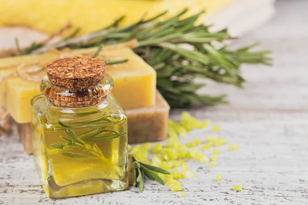 Natural cosmetic oil and natural handmade soap with rosemary on