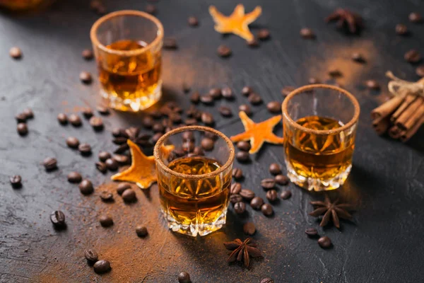 Whiskey, brandy or liquor, spices, anise stars, coffee beans, ci