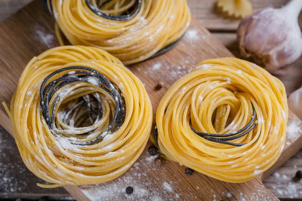 Raw homemade pasta with flour, garlic and spices — Stock Photo, Image