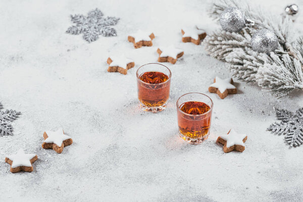 Whiskey, brandy or liquor, cookies and chrastmas decorations on 