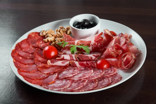 Assorted cold meat deli plate at the restaurant — Stock Photo, Image
