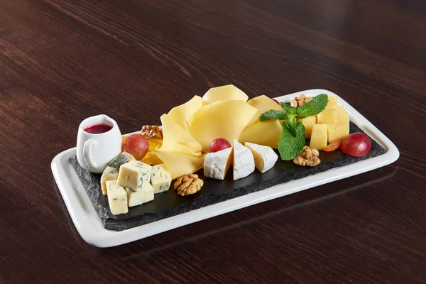 Delicious cheese plate on a restaurant table