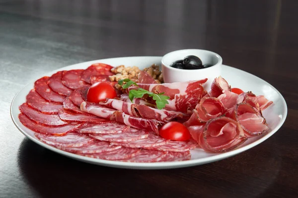 Assorted cold meat deli plate at the restaurant — Stock Photo, Image