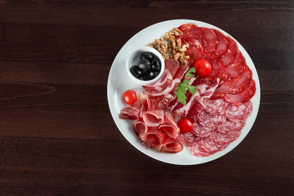 Assorted cold meat deli plate at the restaurant — Stock Photo, Image