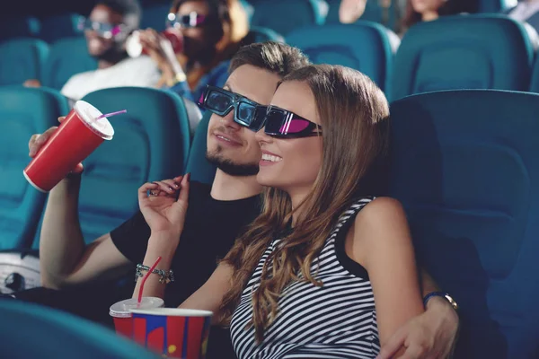 Boyfriend and gifrliend in modern cinema watching film. — Stock Photo, Image