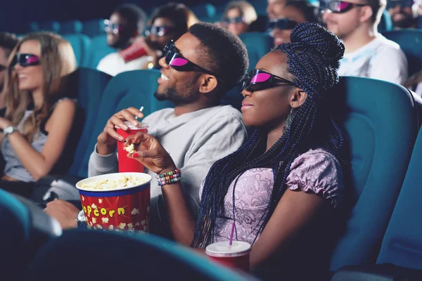 Boyfriend and girlfriend in 3d glasses watching movie in cinema. — Stock Photo, Image