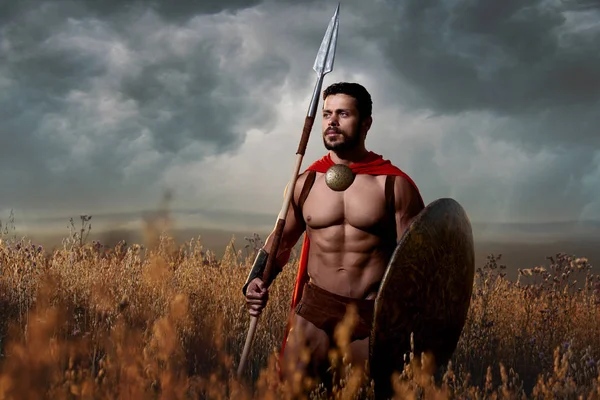 Warrior with sword and shield going in attack. — Stock Photo, Image