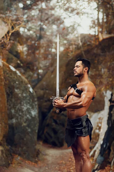 Manly warrior at the mountains — Stock Photo, Image