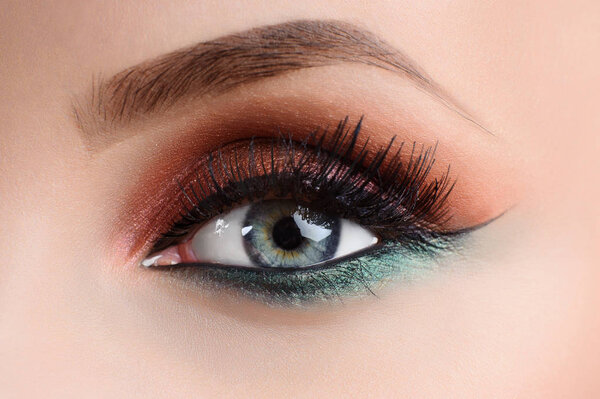 Close up shot of an eye of a female model with professional colo