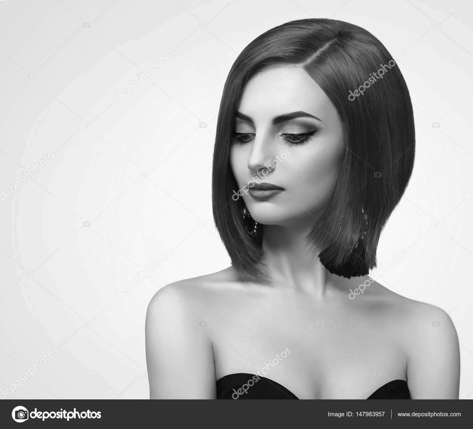 Black and white studio shots of a classy young woman with short stock image