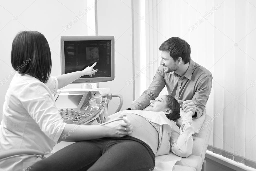 Monochrome shot of a loving pregnant couple at the hospital