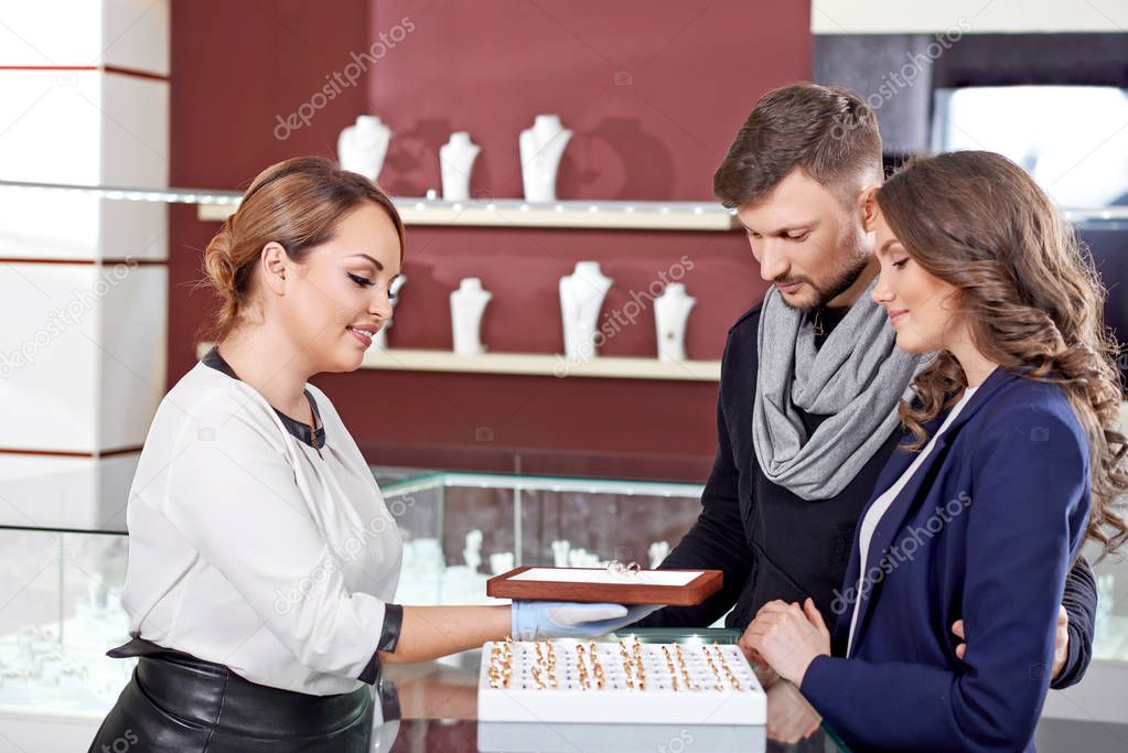 Young couple buying jewelry