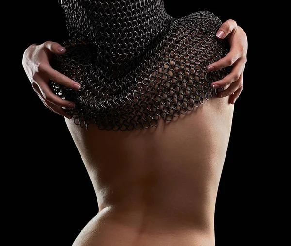 Naked sexy young woman wearing chain mail — Stock Photo, Image