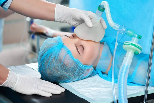 Female patient undergoing surgery Stock Photo