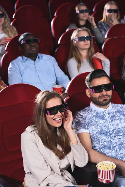 Young people watching 3D film at the movie theatre — Stock Photo, Image