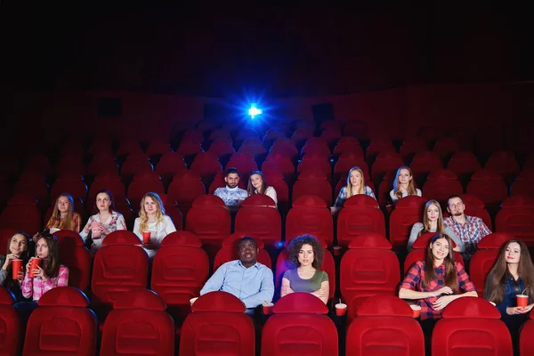 Group of people enjoying movie at the cinema