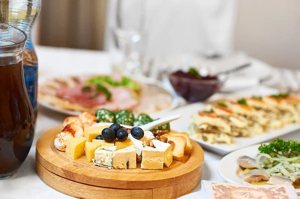 Cheese plate on a restaurant table — Stock Photo, Image