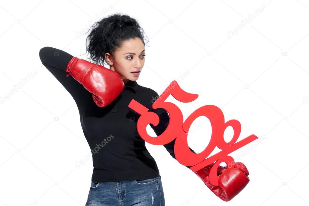 Young beautiful woman wearing boxing gloves