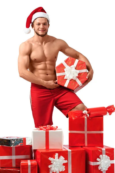 Sexy Weihnachtsmann mit einem Stapel Geschenke — Stockfoto