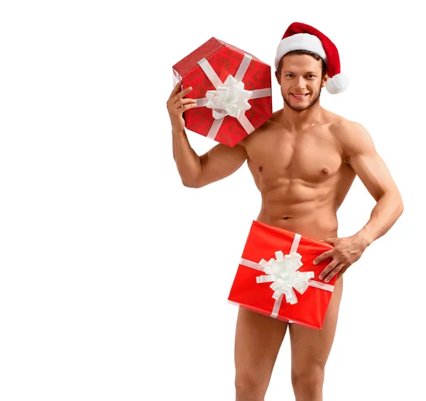 Desnudo santa posando con regalos — Foto de Stock