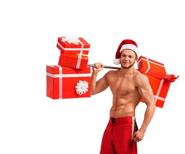 Ajuste desnudo Santa Claus con una barra llena de regalos — Foto de Stock