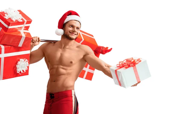 Ripped Santa Claus holding barbell and giving presents — Stock Photo, Image