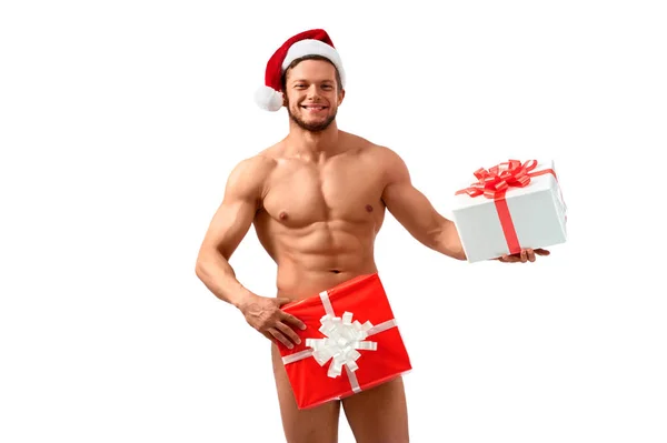 Desnudo santa posando con regalos — Foto de Stock