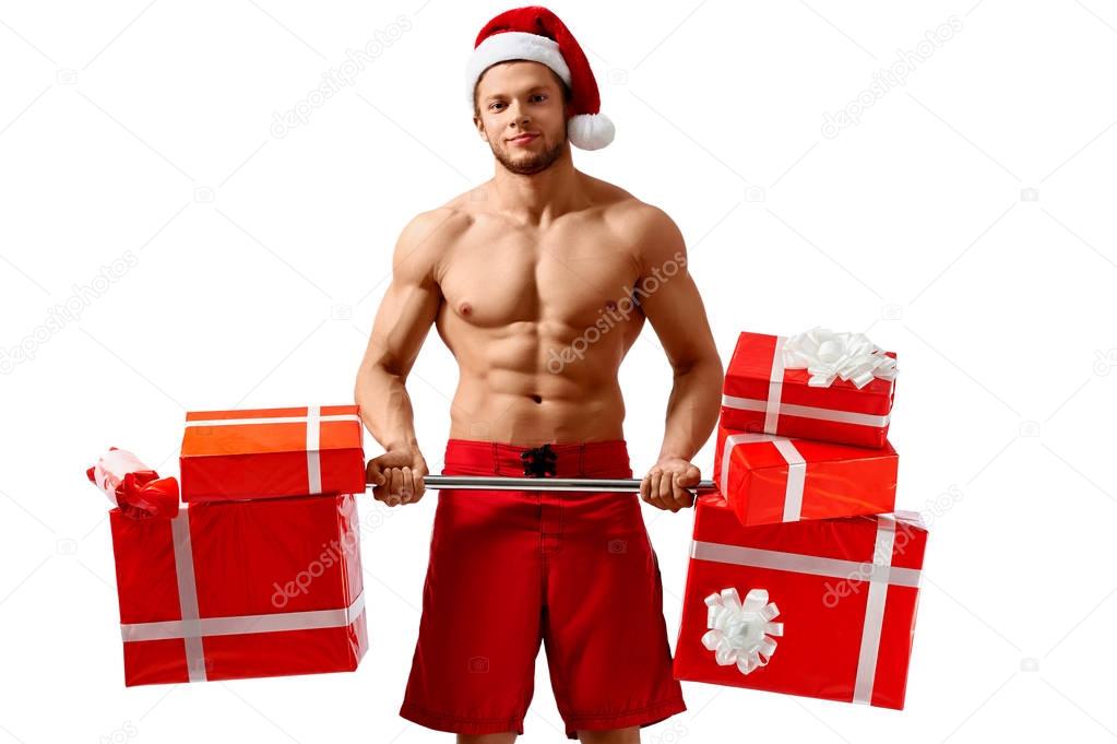 Ripped Santa holding a barbell with presents