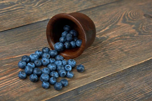 Blueberries on wooden background — Stock Photo, Image