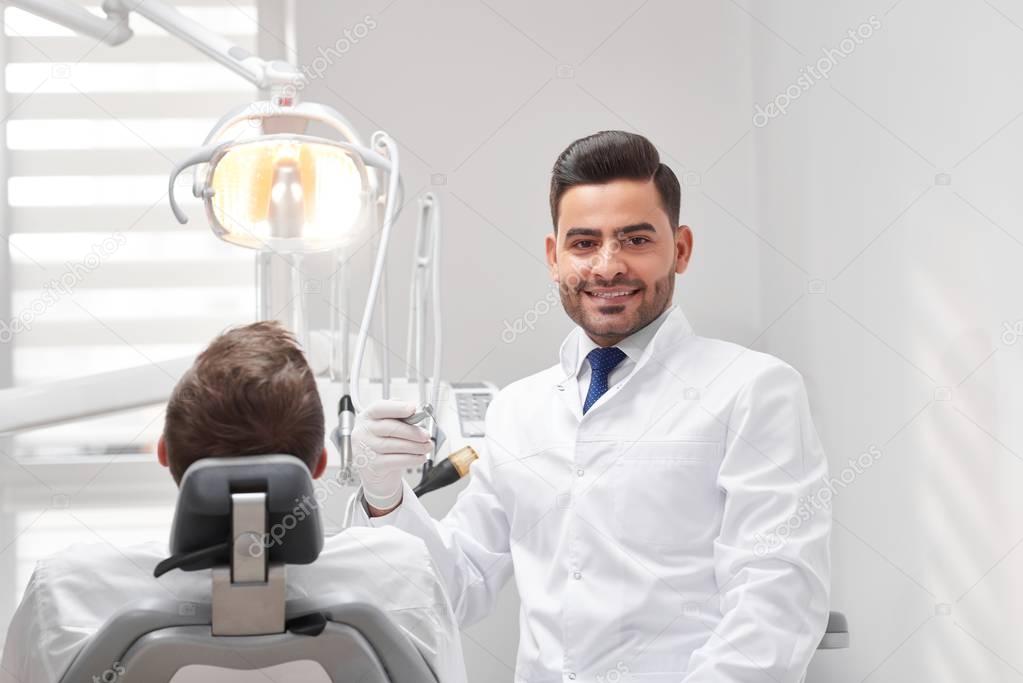 Professional dentist at his clinic