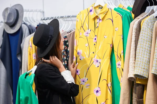 Young woman shopping for clothes