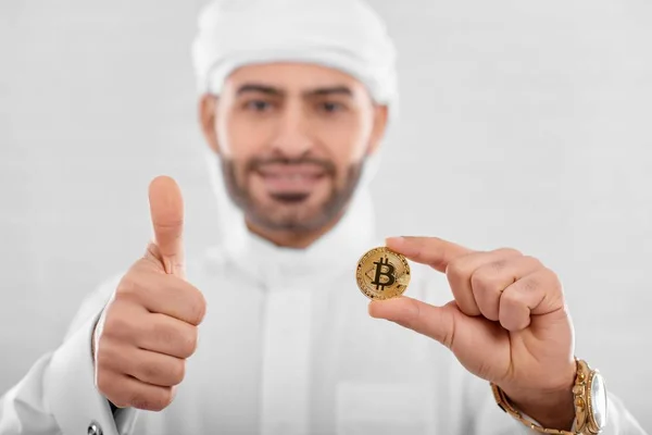 Handsome Arabian man with bitcoin — Stock Photo, Image