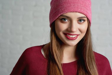 Pretty girl wearing pink cap. clipart