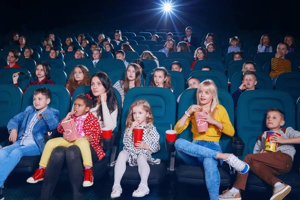 Frontview of emotional people watching film in the new cinema. — Stock Photo, Image